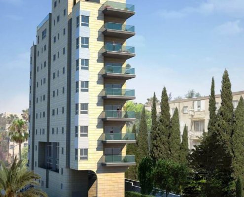 בניין עם עצים ומכוניות שחונות מולו